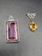 A Pair Of Vintage Art Deco Ornate Yellow And Pink Stone Silver Tone Pendants