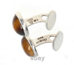 A pair of 1960 Gussi silver and tigers eye cufflinks Vintage Scandinavian