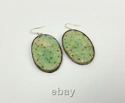 A pair of Vintage Silver Carved Jade Earrings