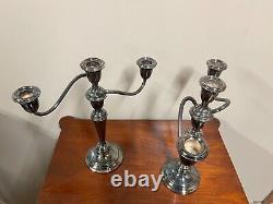 A pair of vintage sterling silver weighted candelabra candlesticks