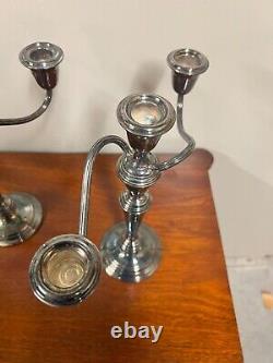 A pair of vintage sterling silver weighted candelabra candlesticks