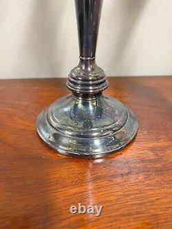 A pair of vintage sterling silver weighted candelabra candlesticks