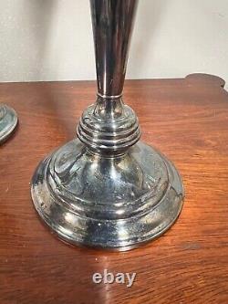 A pair of vintage sterling silver weighted candelabra candlesticks