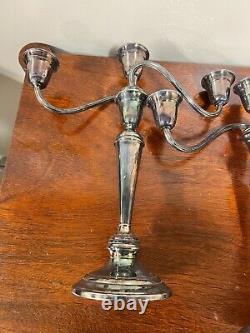 A pair of vintage sterling silver weighted candelabra candlesticks