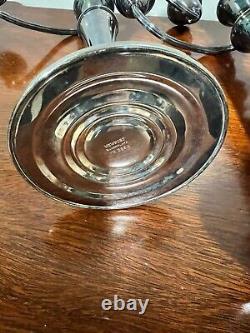 A pair of vintage weighted silver plated candelabra candlesticks