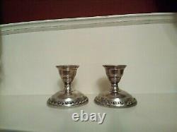 PAIR of LA PIERRE VINTAGE WEIGHTED SILVER CANDLESTICK HOLDERS HALLMARKED