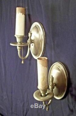 VINTAGE PAIR OF EARLY 20th CENTURY REGENCY OVAL BACK SILVER PLATE SCONCES