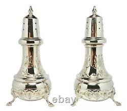 Vintage solid. 925 sterling silver pair of repousse footed salt & pepper shakers
