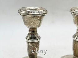 Paire de bougeoirs en argent massif vintage