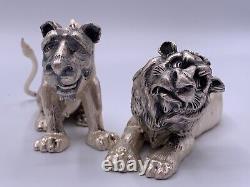 Paire de figurines en argent sterling vintage représentant un lion et une lionne signée fait main.