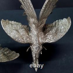 Paire de sculptures décoratives de coqs de combat en argent vintage